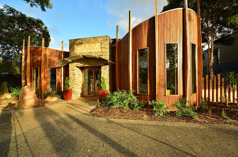 Natural timber and stone greet clients at the entry to the building.