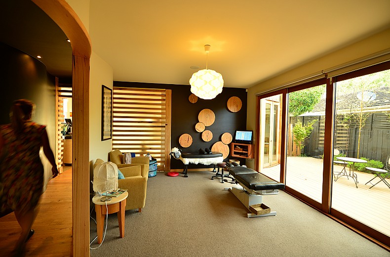 One of the treatment rooms off the curved hallway, opens onto an outdoor relaxation area.
