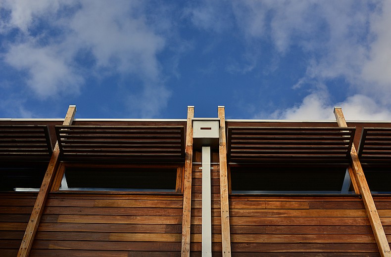 Timber detailing along the sides and rear of the upper storey.